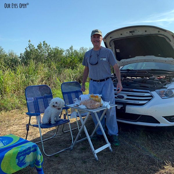 Preparing lunch with our folding chairs and tables at Merritt Island Wildlife Refuge.  We used the hood of my car for shade.